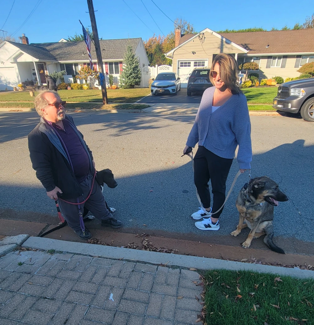 Robert training a dog outdoors with a leash